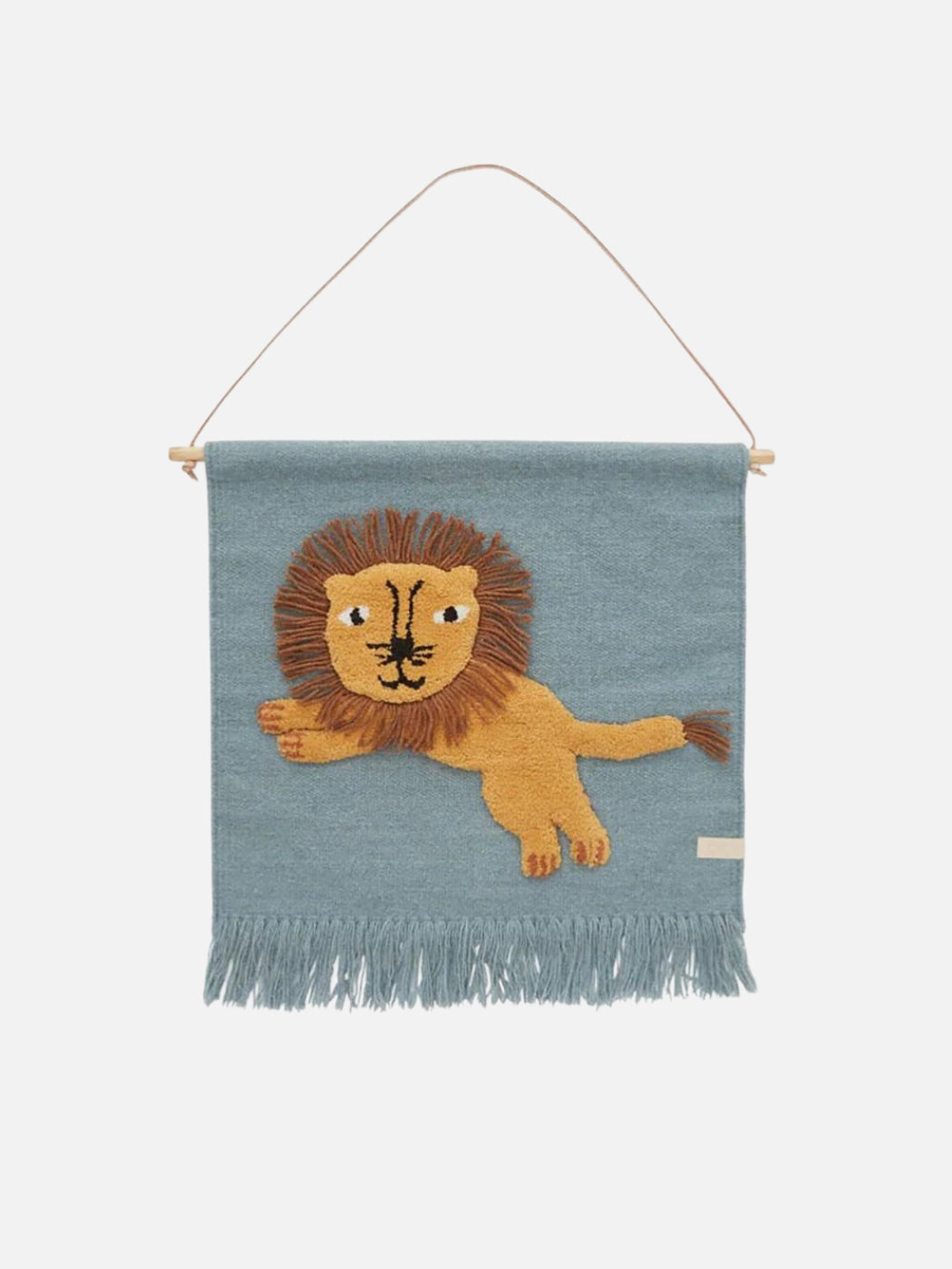 A blue wall hanging with a lion on it